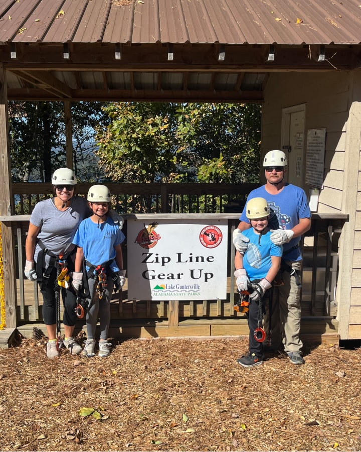 family ziplining at screaming eagle aerial adventure park lake Guntersville